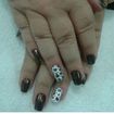 Unhas decoradas com oncinha