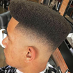 Cabelo Afro corte FADE com leve pigmentação. 